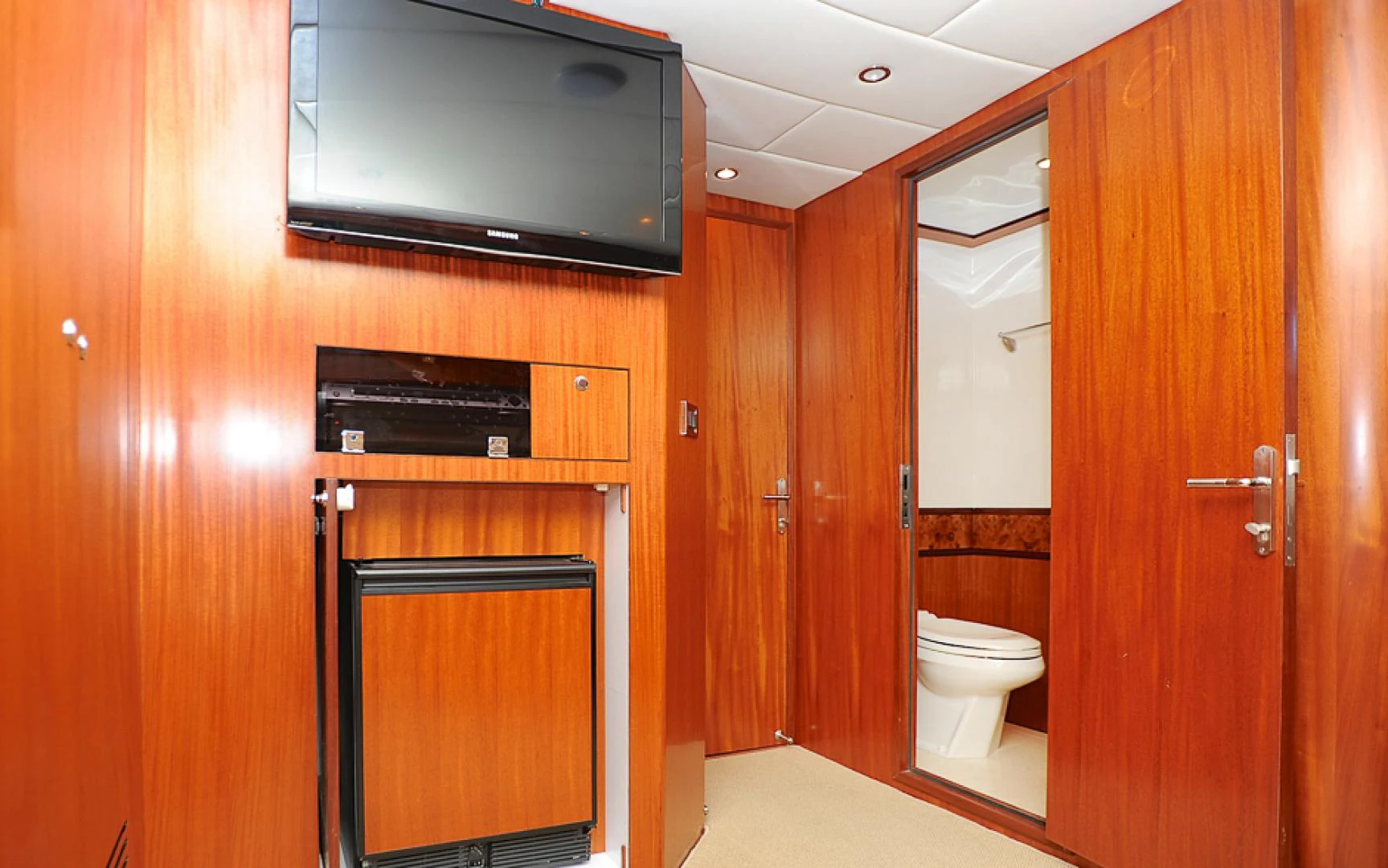 a bathroom with wooden cabinets aboard MARANATHA Yacht for Sale