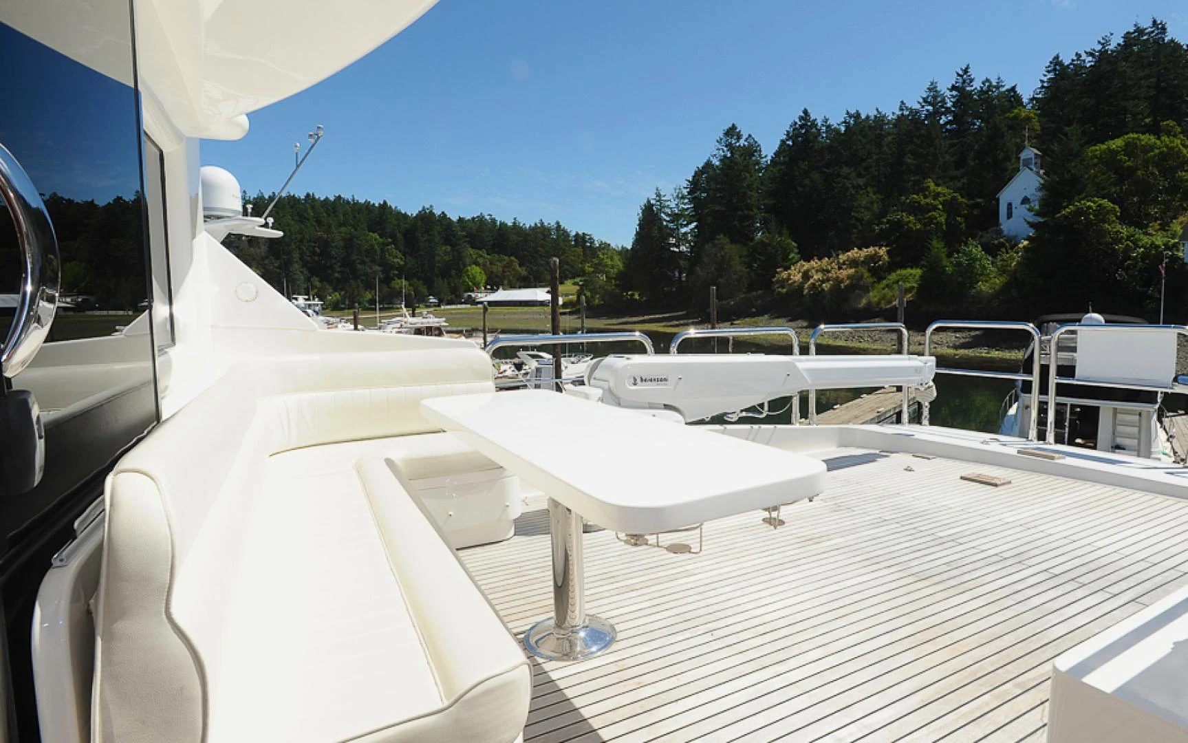a white boat on a deck aboard MARANATHA Yacht for Sale