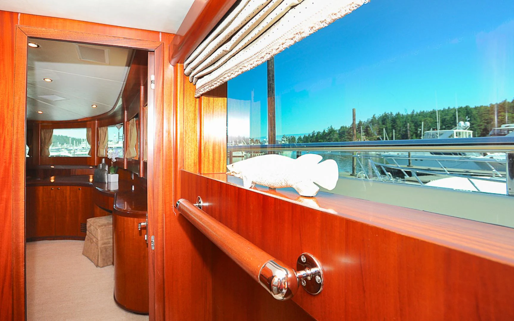 a room with a large window and a view of a city aboard MARANATHA Yacht for Sale