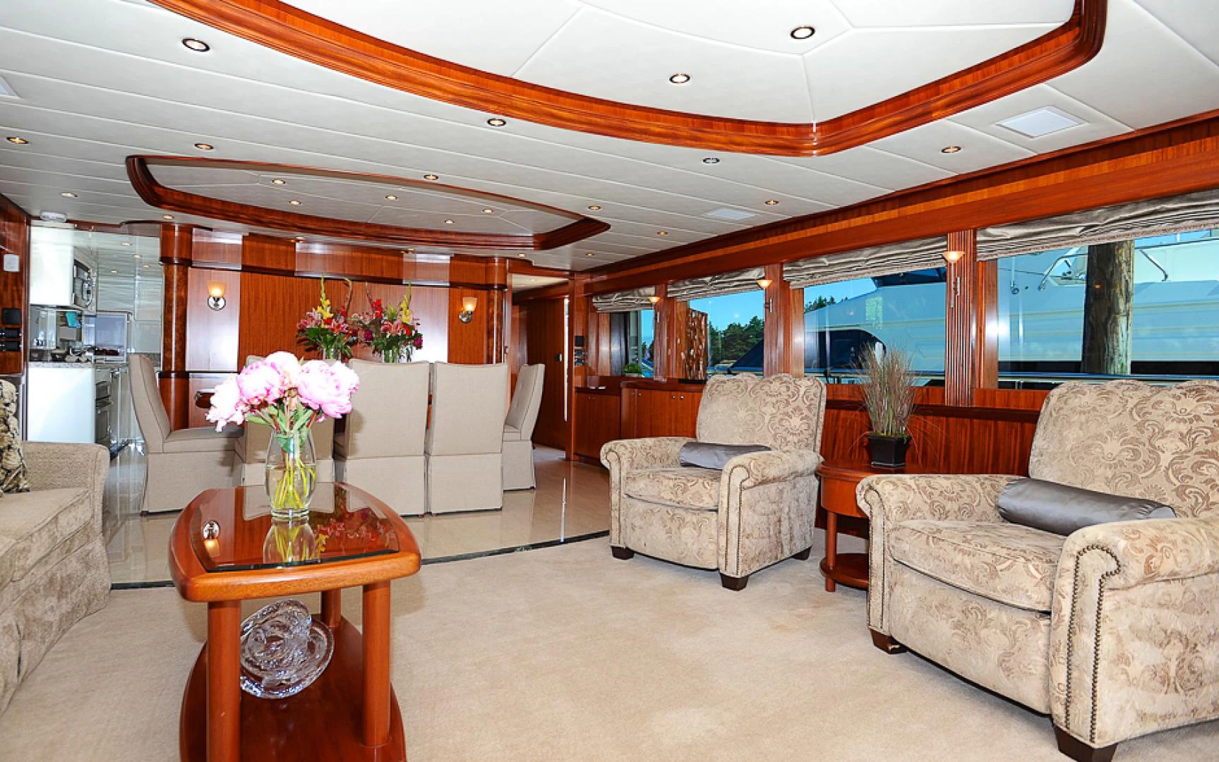 a living room with a couch and a table aboard MARANATHA Yacht for Sale