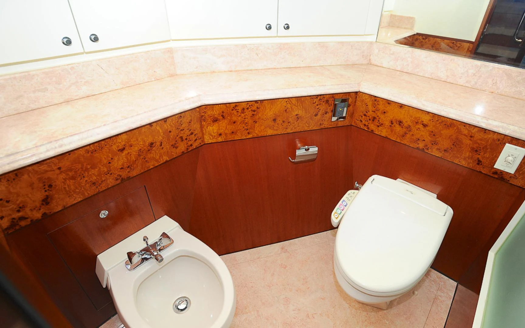 a bathroom with a toilet and sink aboard MARANATHA Yacht for Sale