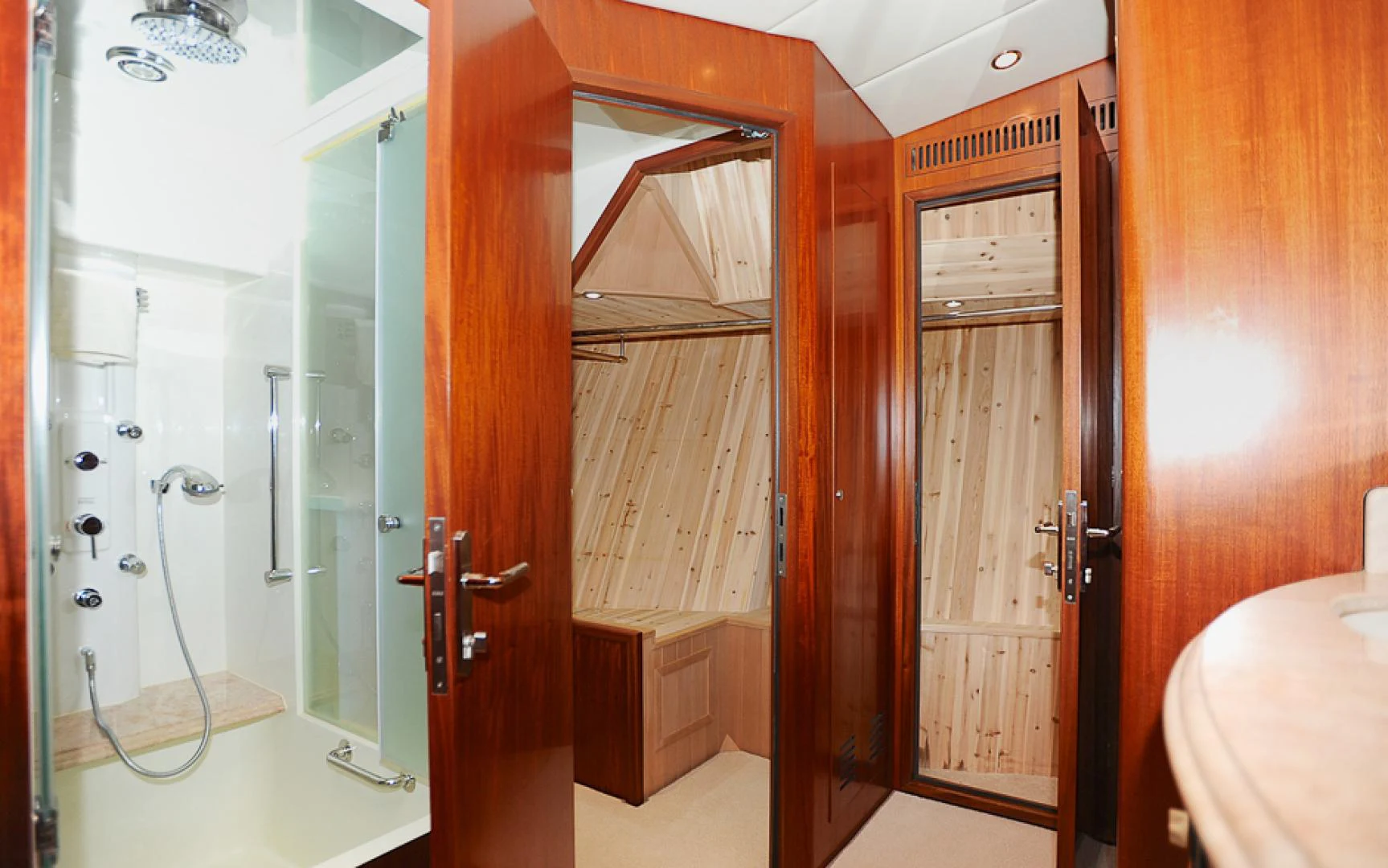 a bathroom with a shower unit and a sink aboard MARANATHA Yacht for Sale