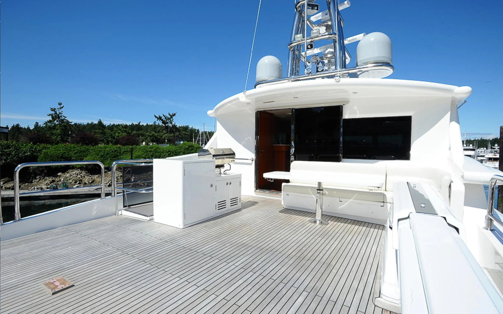 a white boat on a deck aboard MARANATHA Yacht for Sale