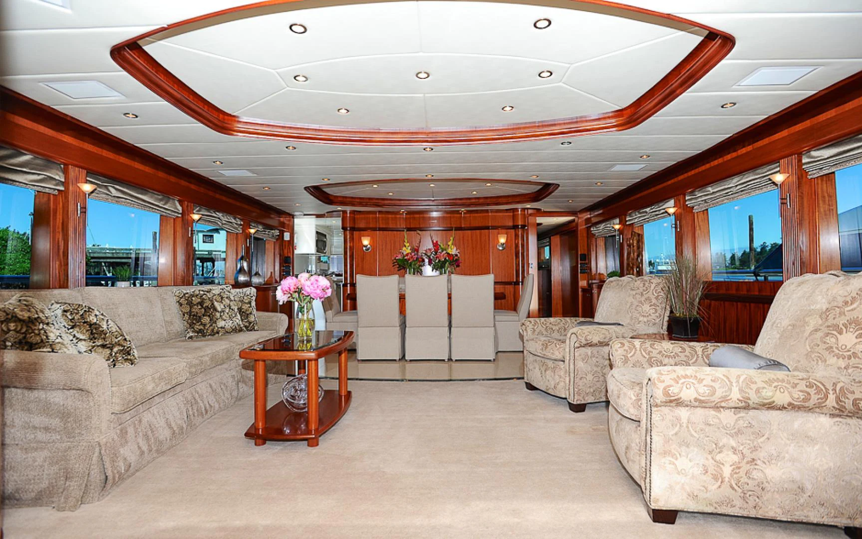 a living room with a couch and a table aboard MARANATHA Yacht for Sale