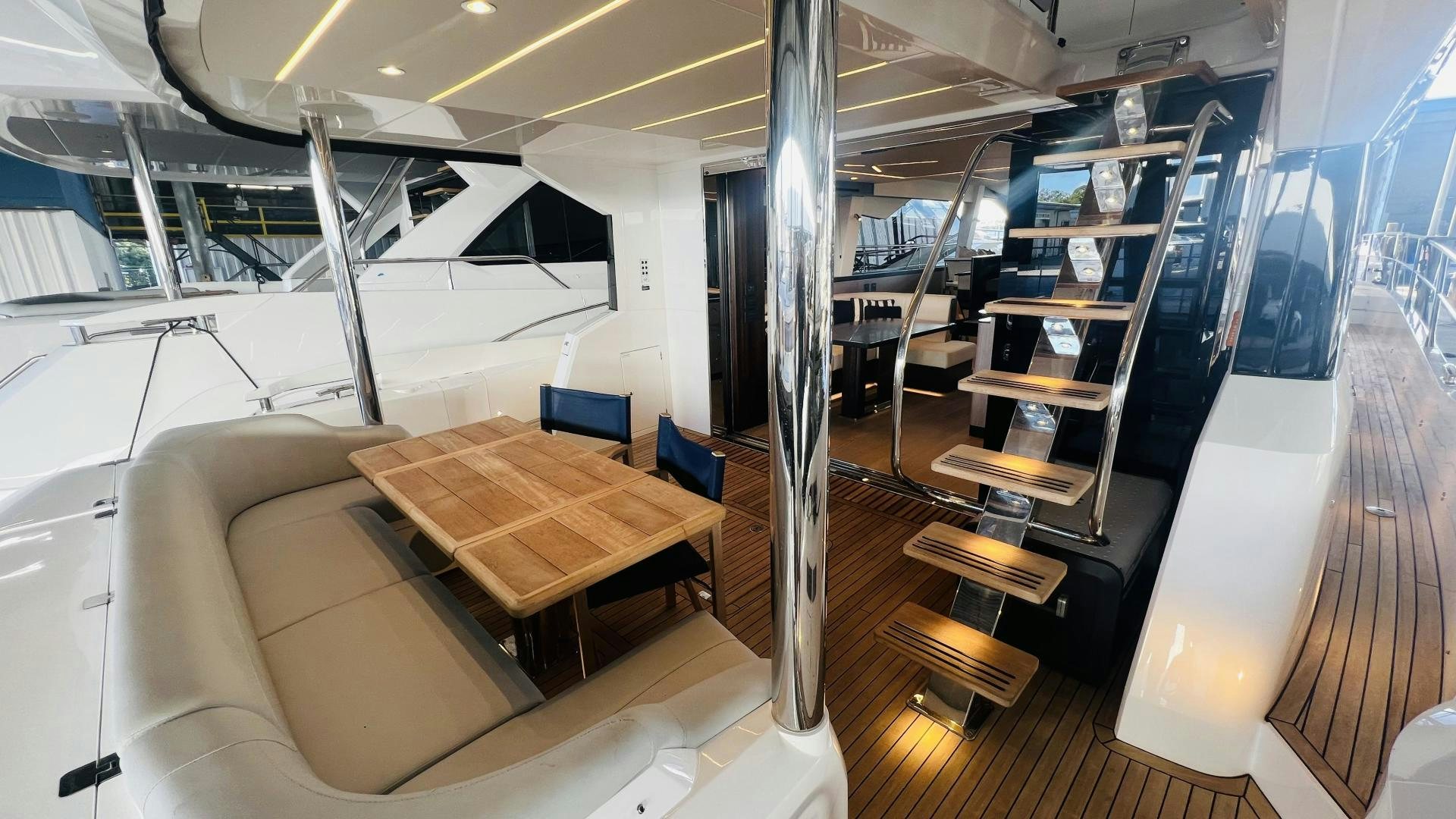 a room with a table and chairs aboard DELICIA Yacht for Sale