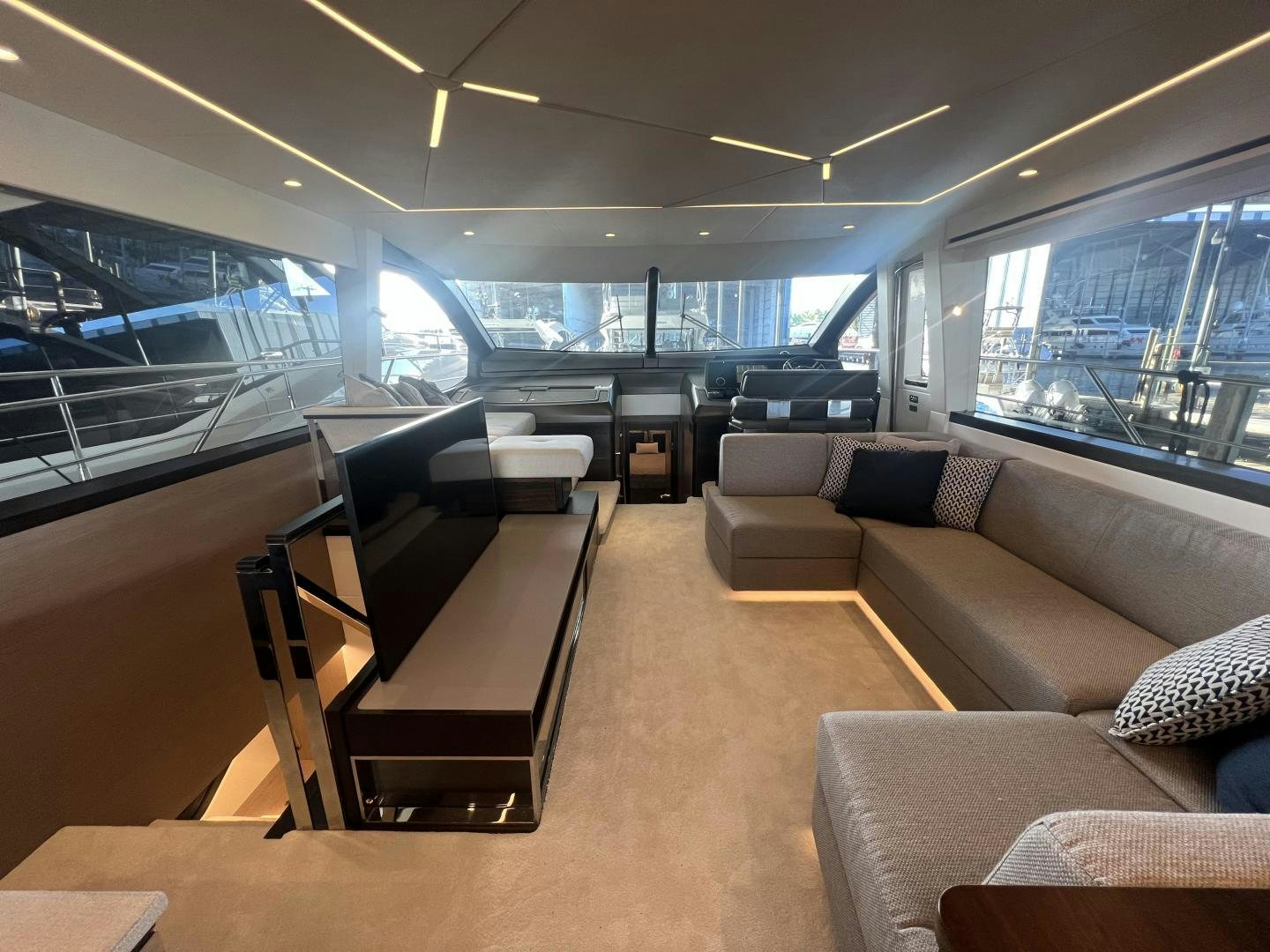 inside of a vehicle with a large window and a couch and a table aboard DELICIA Yacht for Sale