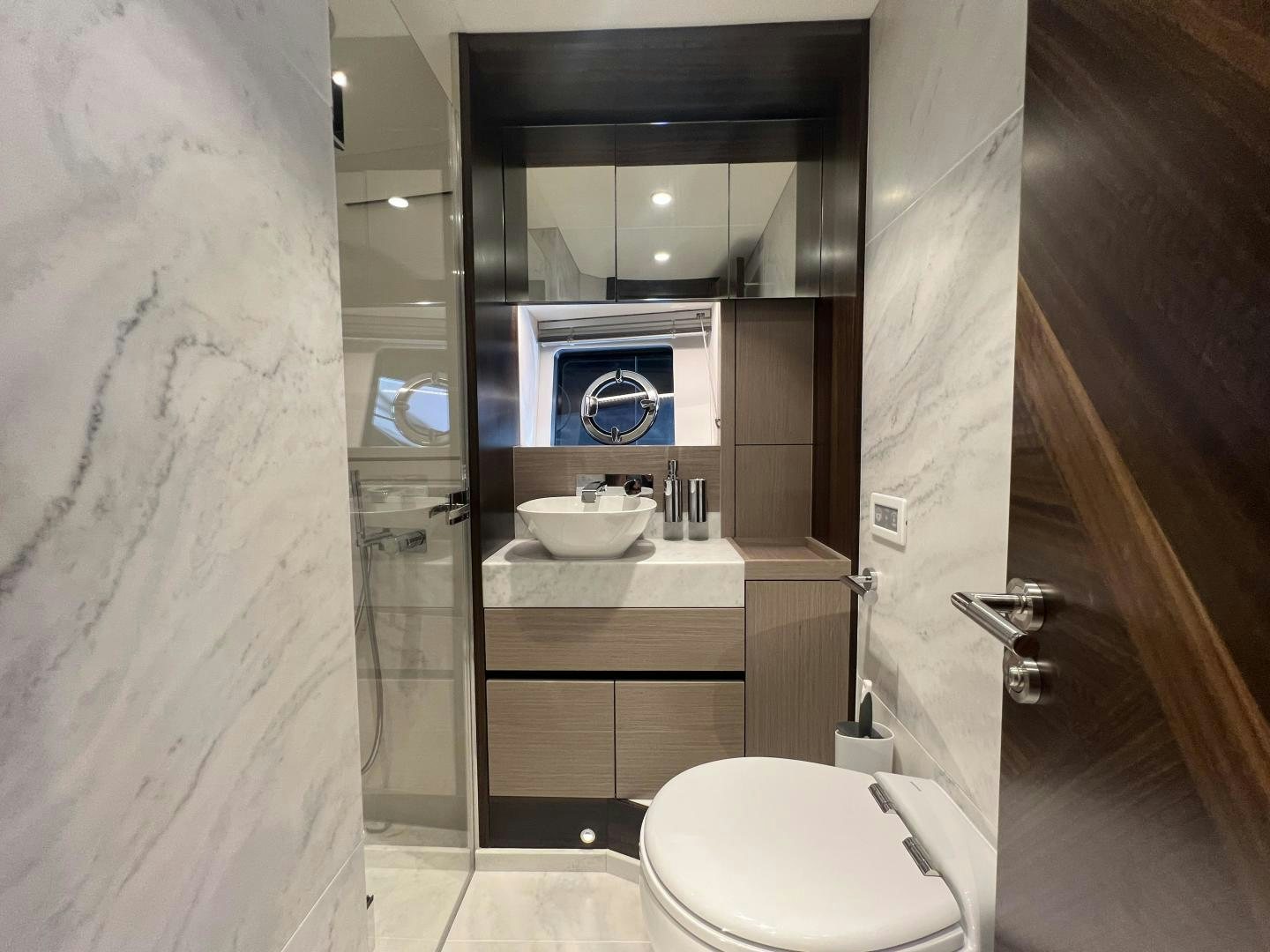 a bathroom with a sink and a toilet aboard DELICIA Yacht for Sale