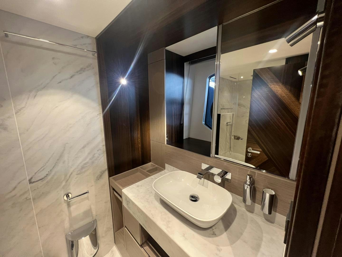 a bathroom with a large mirror aboard DELICIA Yacht for Sale