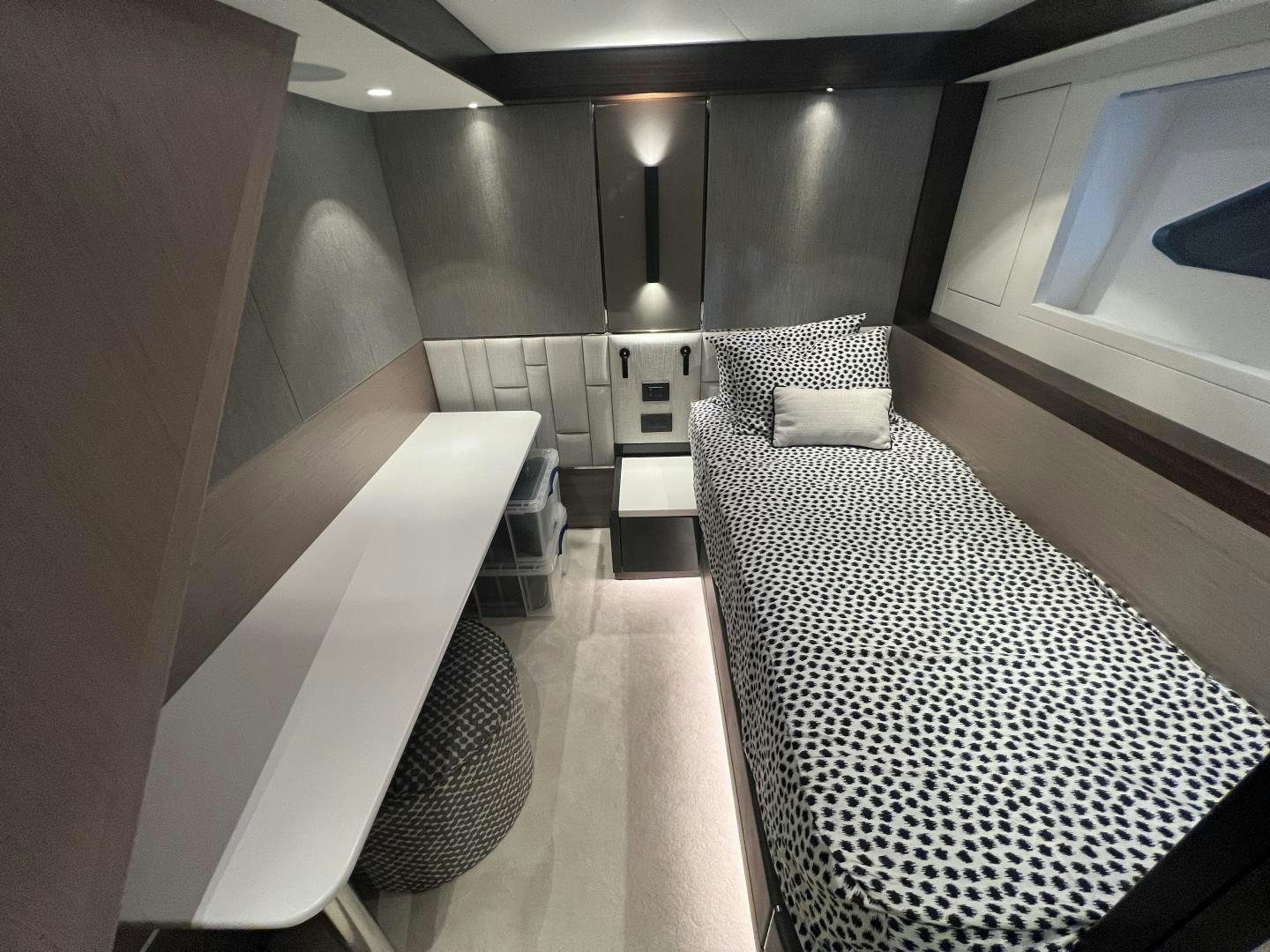 a room with a bed and a chair aboard DELICIA Yacht for Sale