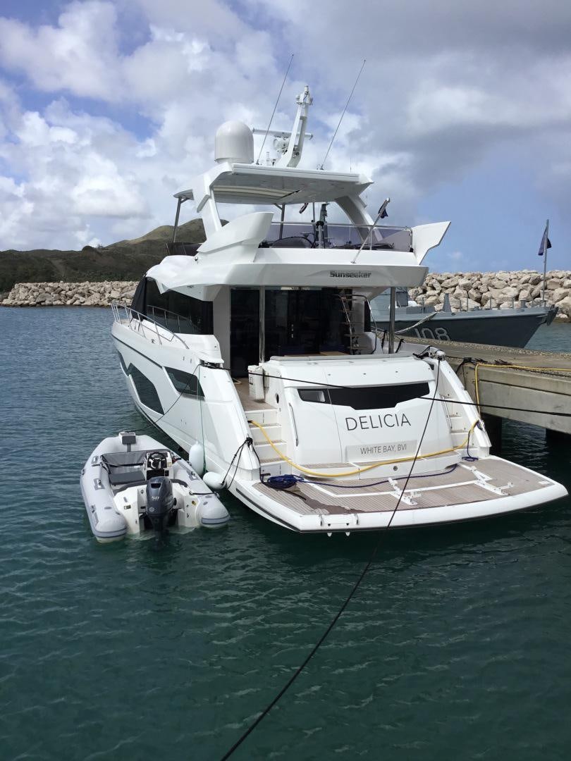 a boat docked at a pier aboard DELICIA Yacht for Sale