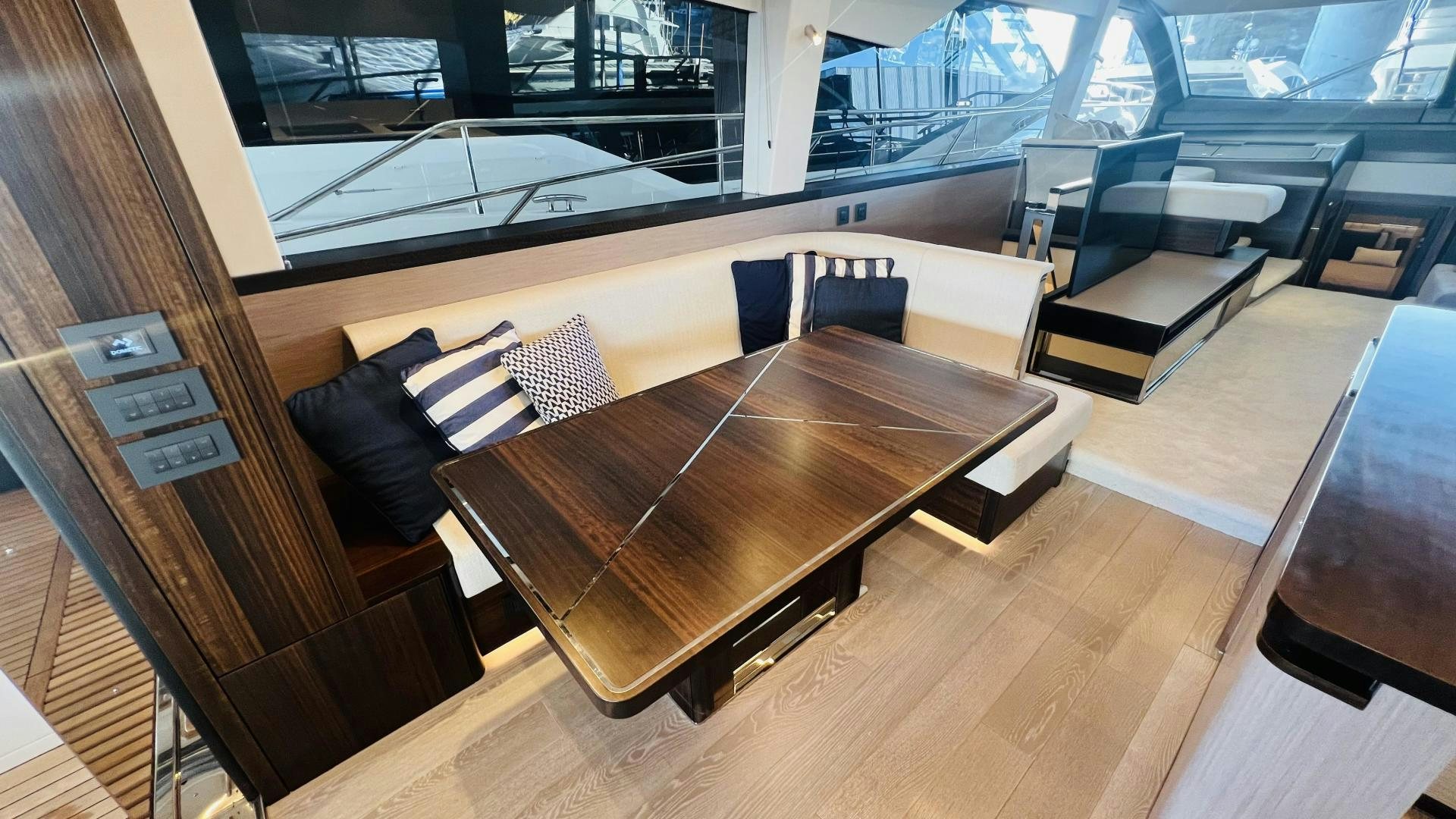a room with a table and chairs aboard DELICIA Yacht for Sale