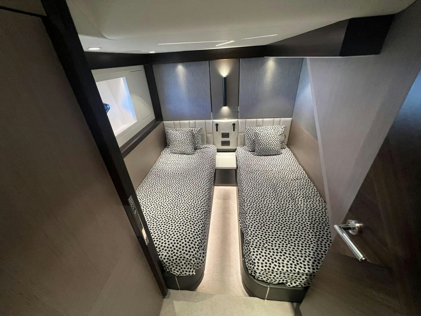 a room with a couple of couches and a window aboard DELICIA Yacht for Sale