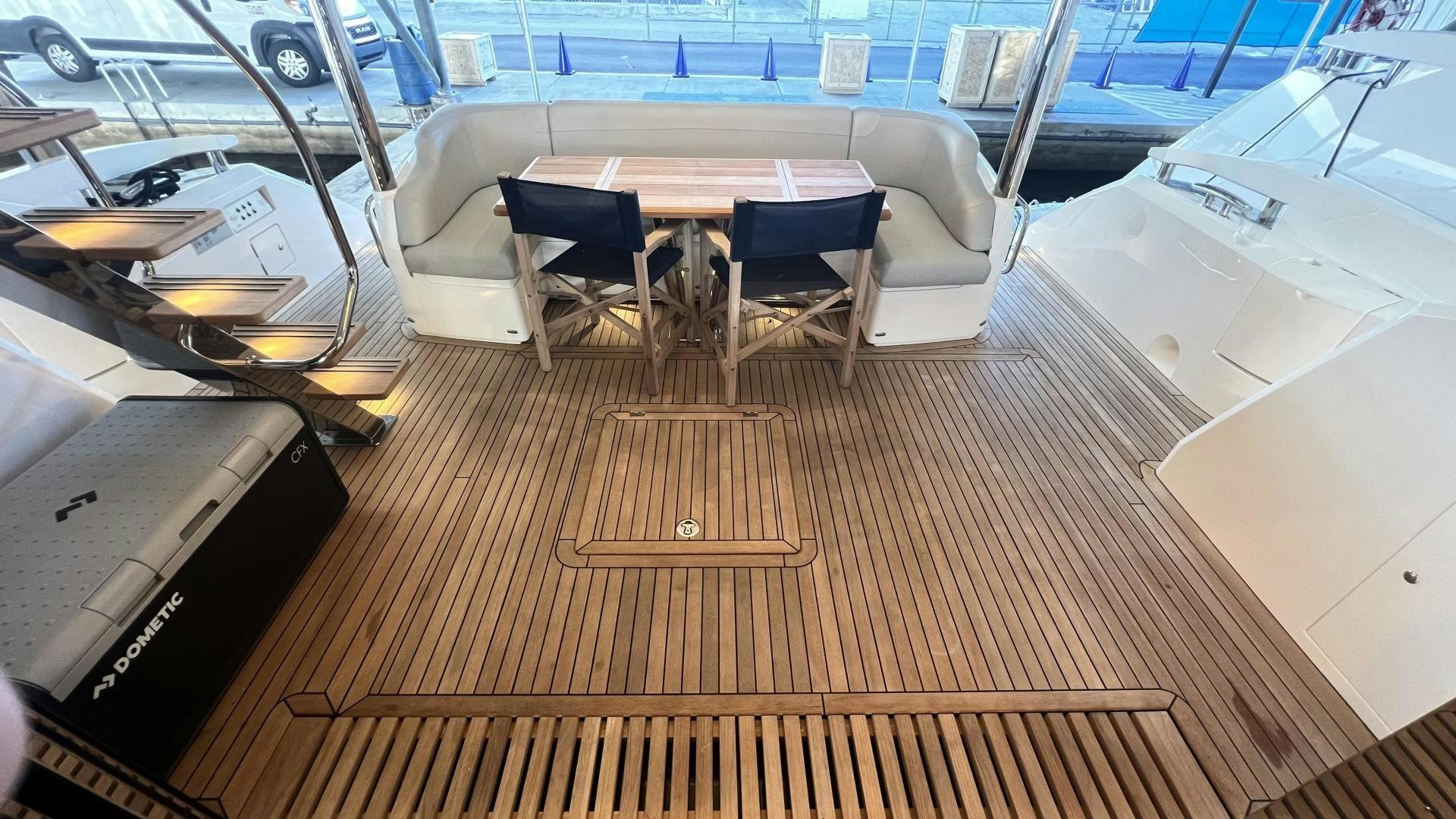a room with a table and chairs aboard DELICIA Yacht for Sale