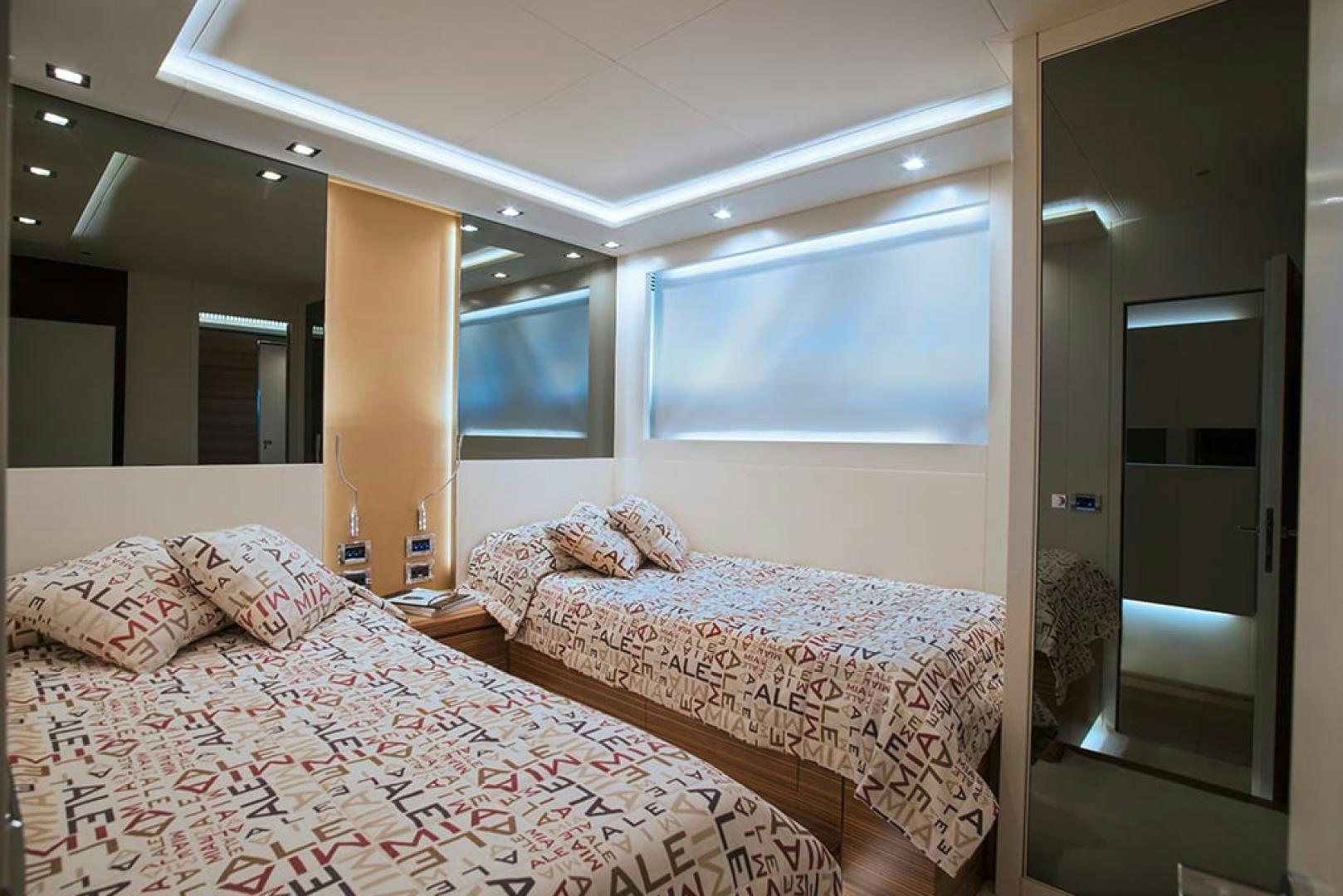 a couple of beds in a hotel room aboard ALE.MIA Yacht for Sale