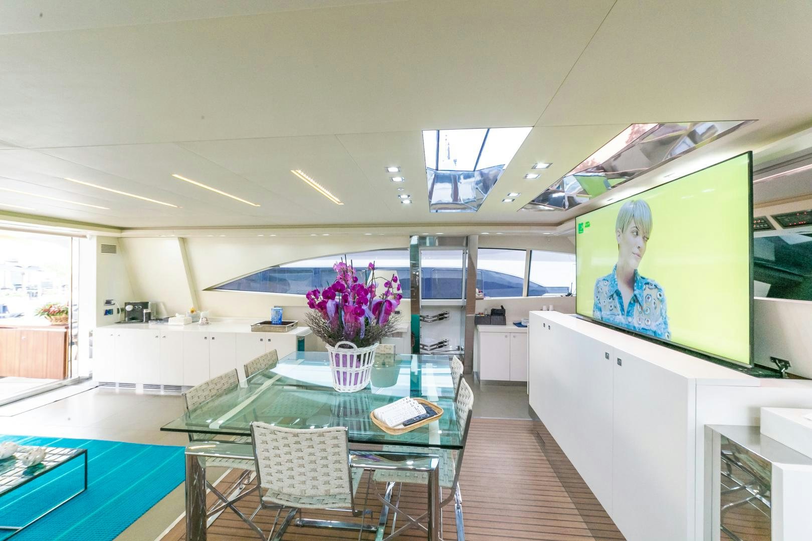 a room with a table and chairs aboard ALE.MIA Yacht for Sale