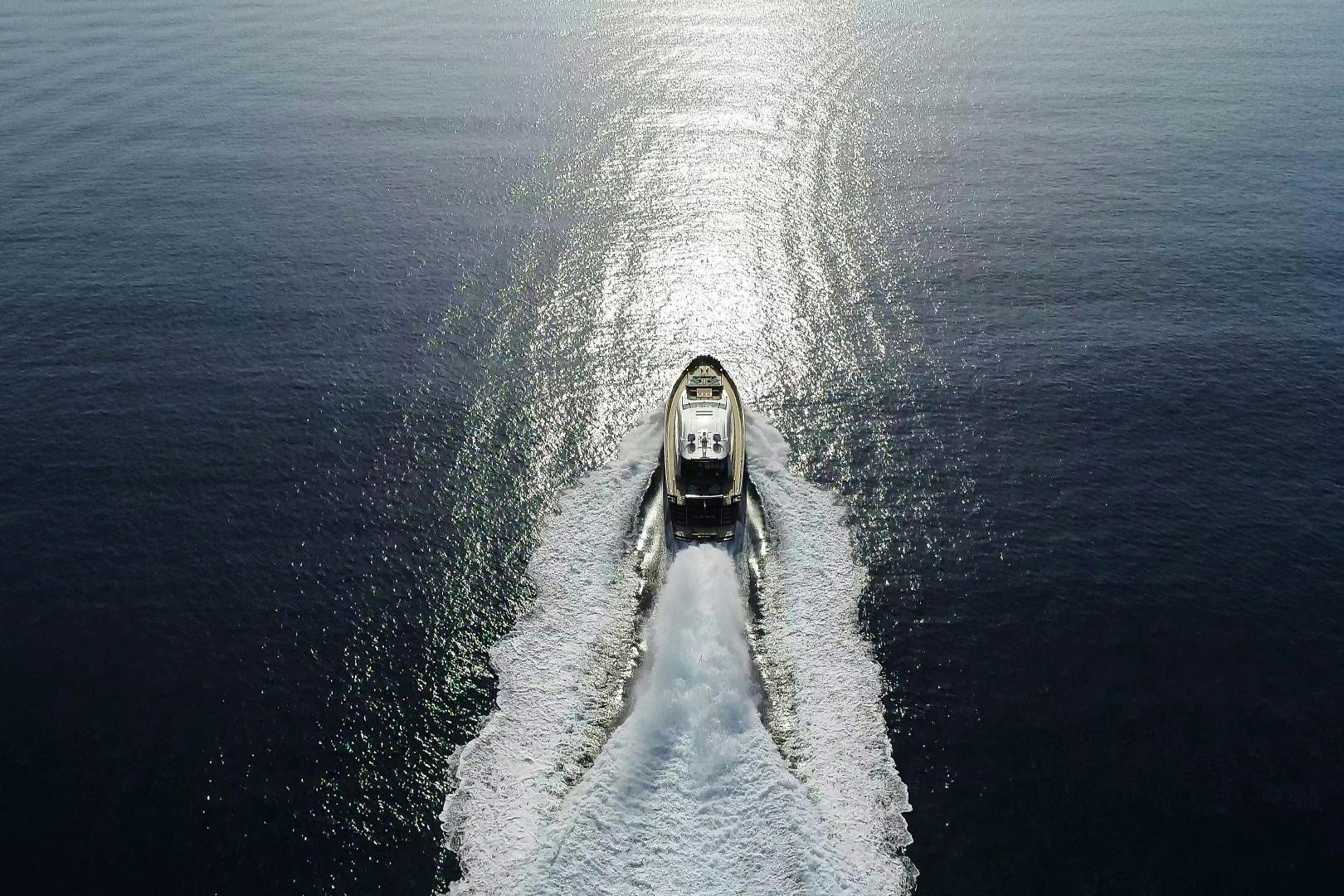 a car driving on a road surrounded by water aboard ALE.MIA Yacht for Sale