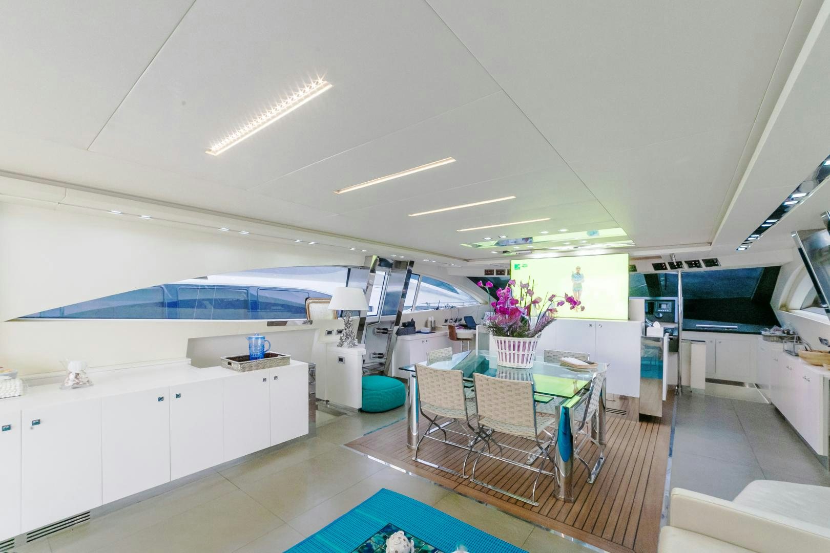 a room with a table and chairs aboard ALE.MIA Yacht for Sale