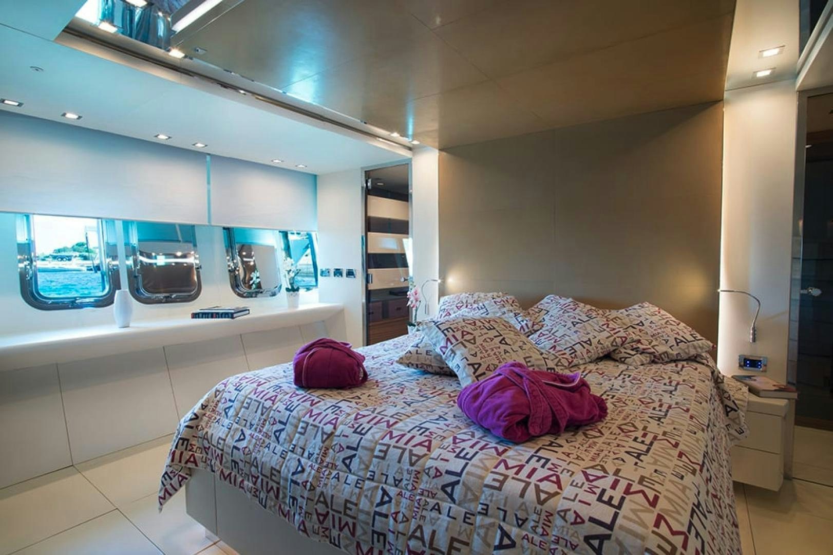 a bed in a room aboard ALE.MIA Yacht for Sale