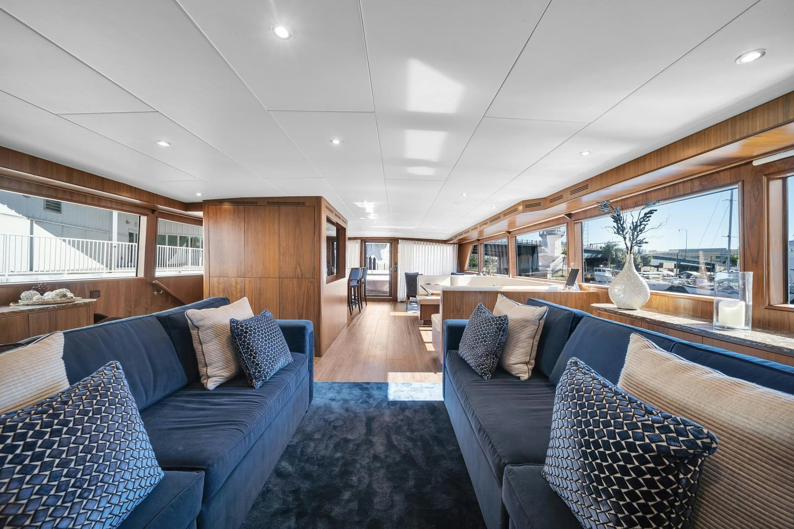 a living room with a large window aboard A PLACE IN THE SUN Yacht for Sale