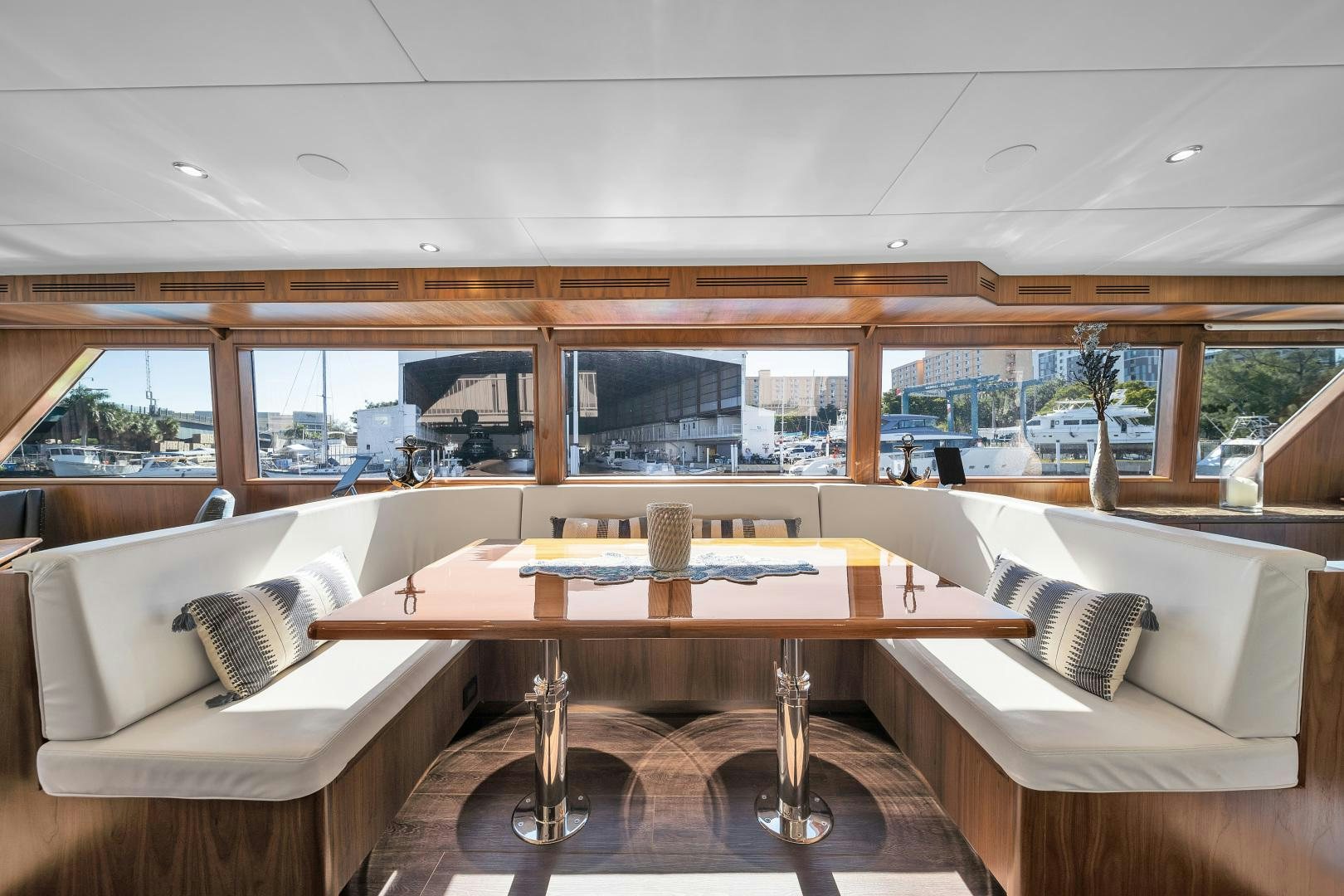 a room with a couch and a table aboard A PLACE IN THE SUN Yacht for Sale