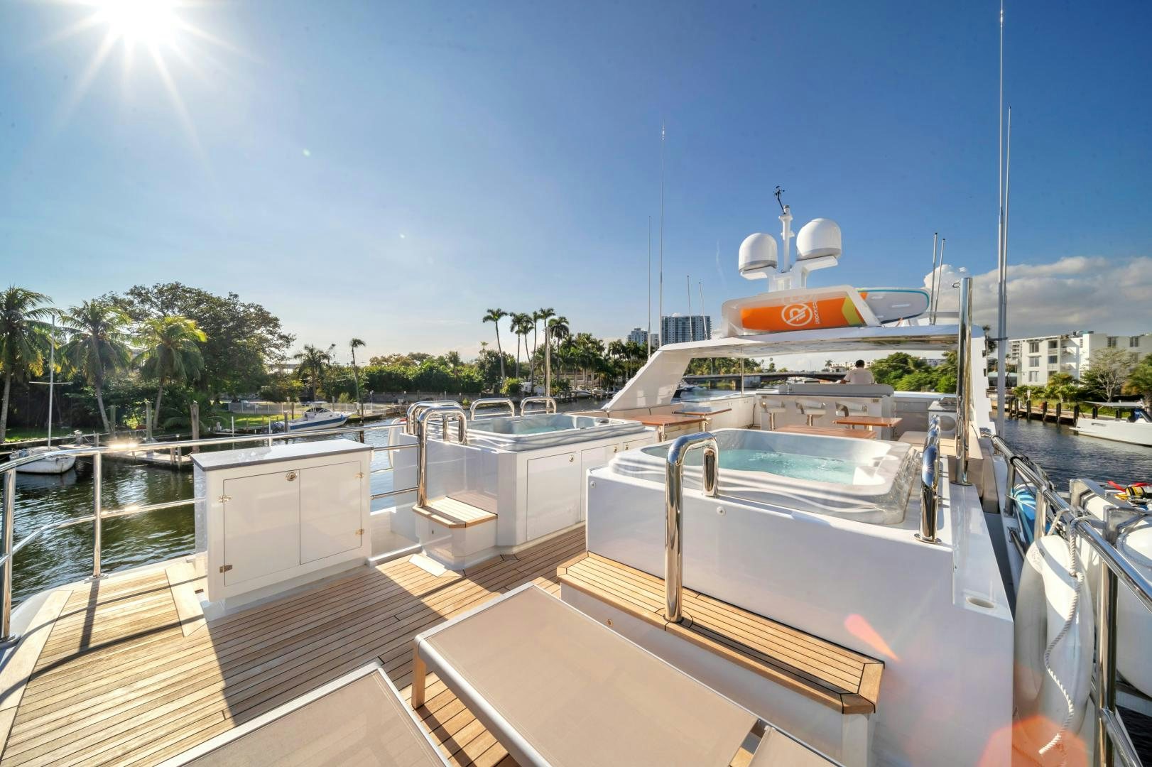 a deck with boats and trees aboard A PLACE IN THE SUN Yacht for Sale