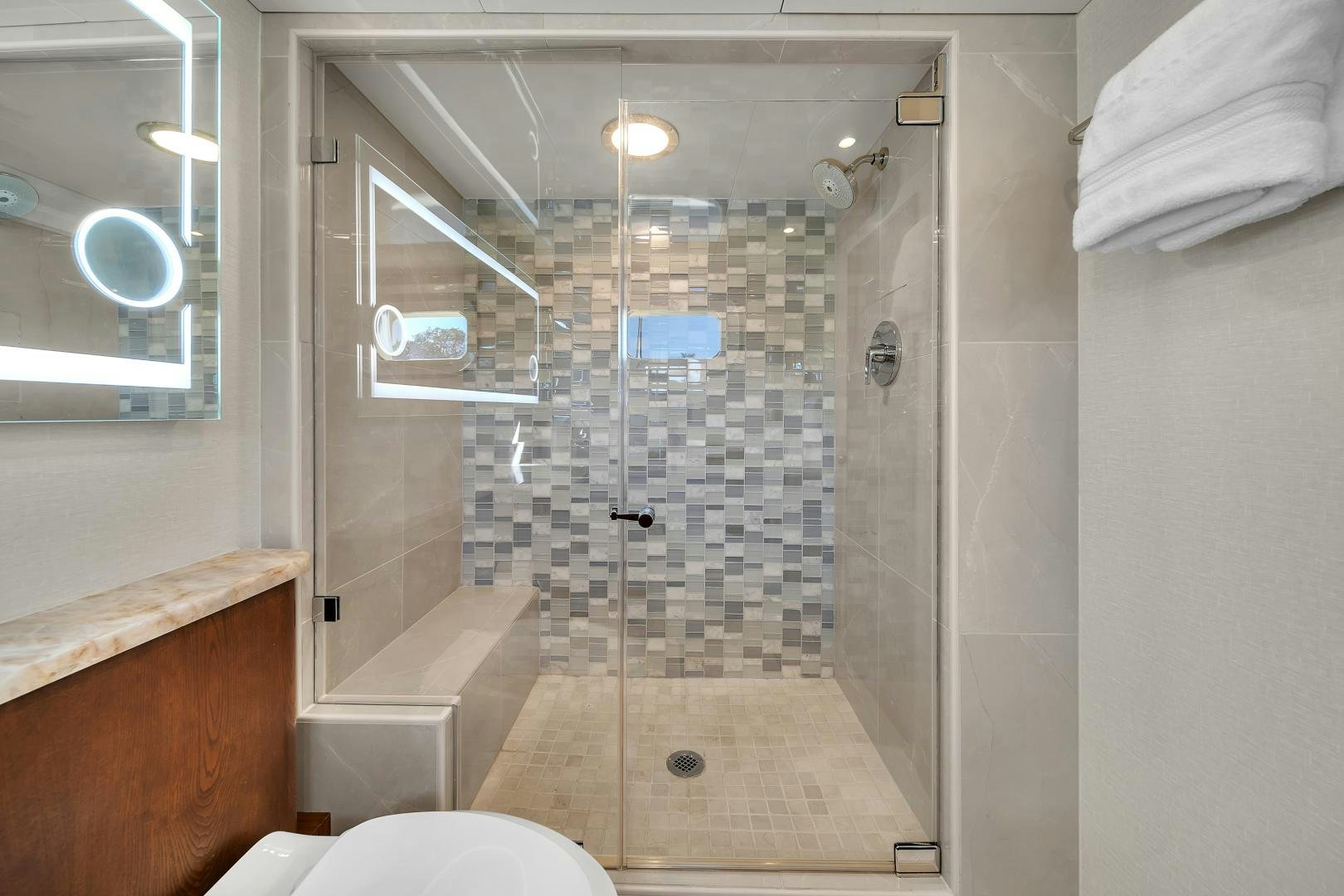 a bathroom with a shower aboard A PLACE IN THE SUN Yacht for Sale