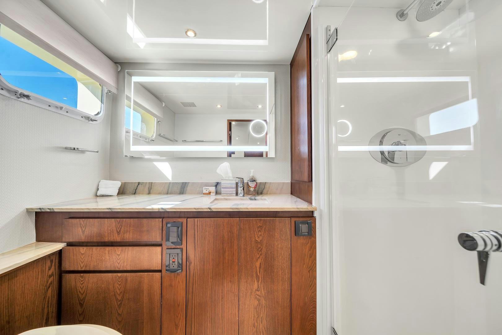 a kitchen with a sink and cabinets aboard A PLACE IN THE SUN Yacht for Sale