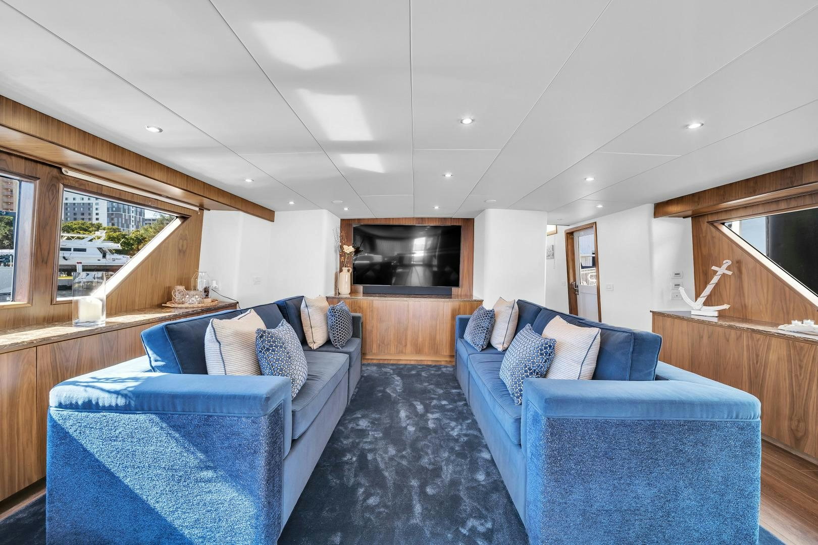 a living room with a couch and a fireplace aboard A PLACE IN THE SUN Yacht for Sale