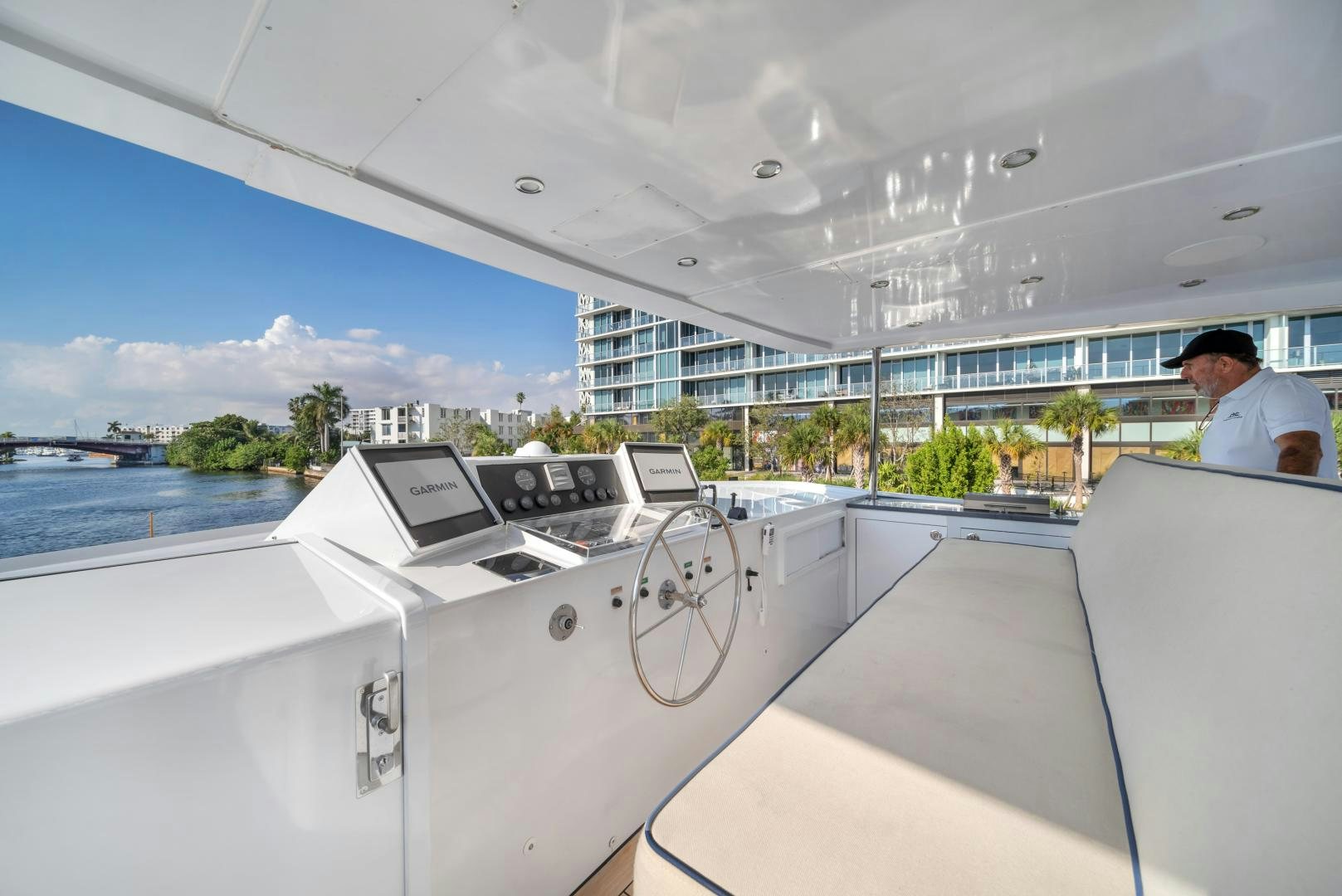a man sitting at a table aboard A PLACE IN THE SUN Yacht for Sale