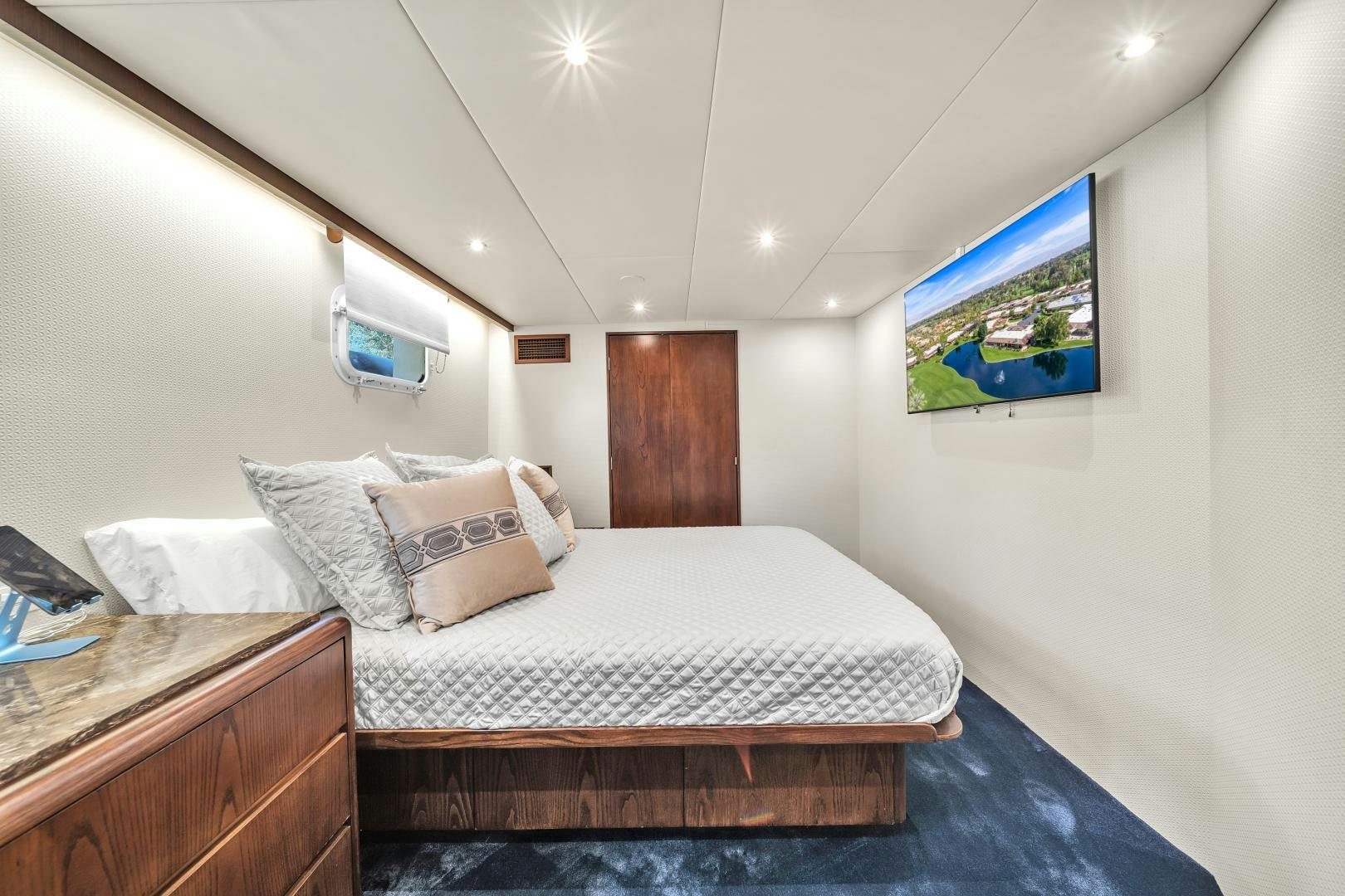 a bed with white sheets and pillows aboard A PLACE IN THE SUN Yacht for Sale