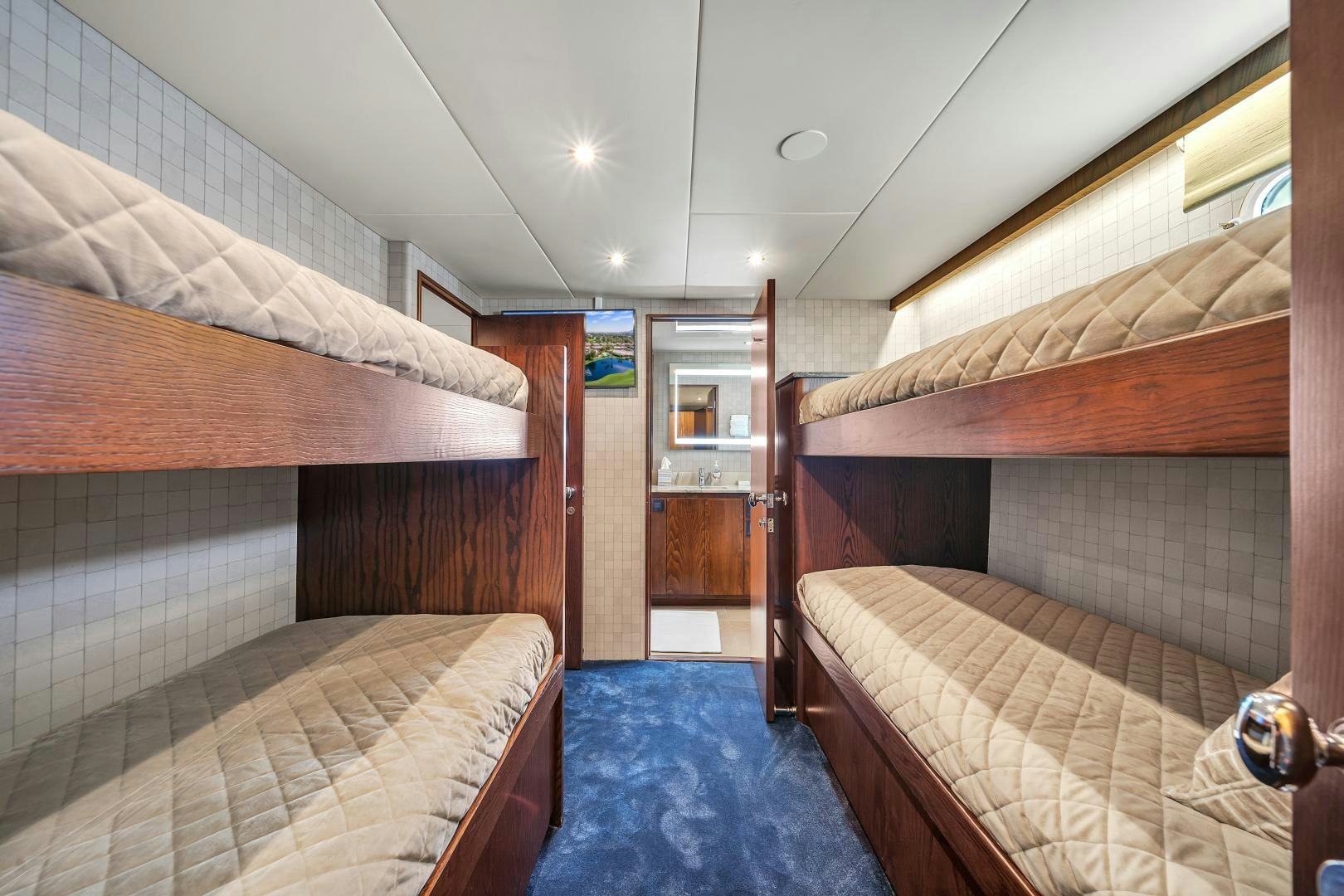 a room with a bed and a mirror aboard A PLACE IN THE SUN Yacht for Sale