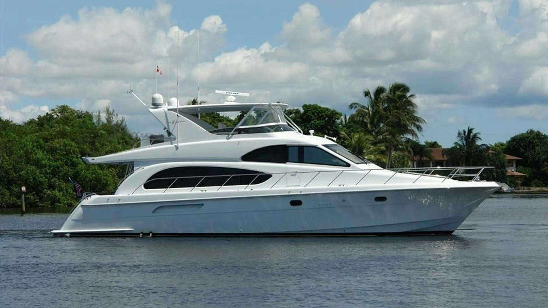 a white yacht on the water aboard 63 HATTERAS Yacht for Sale