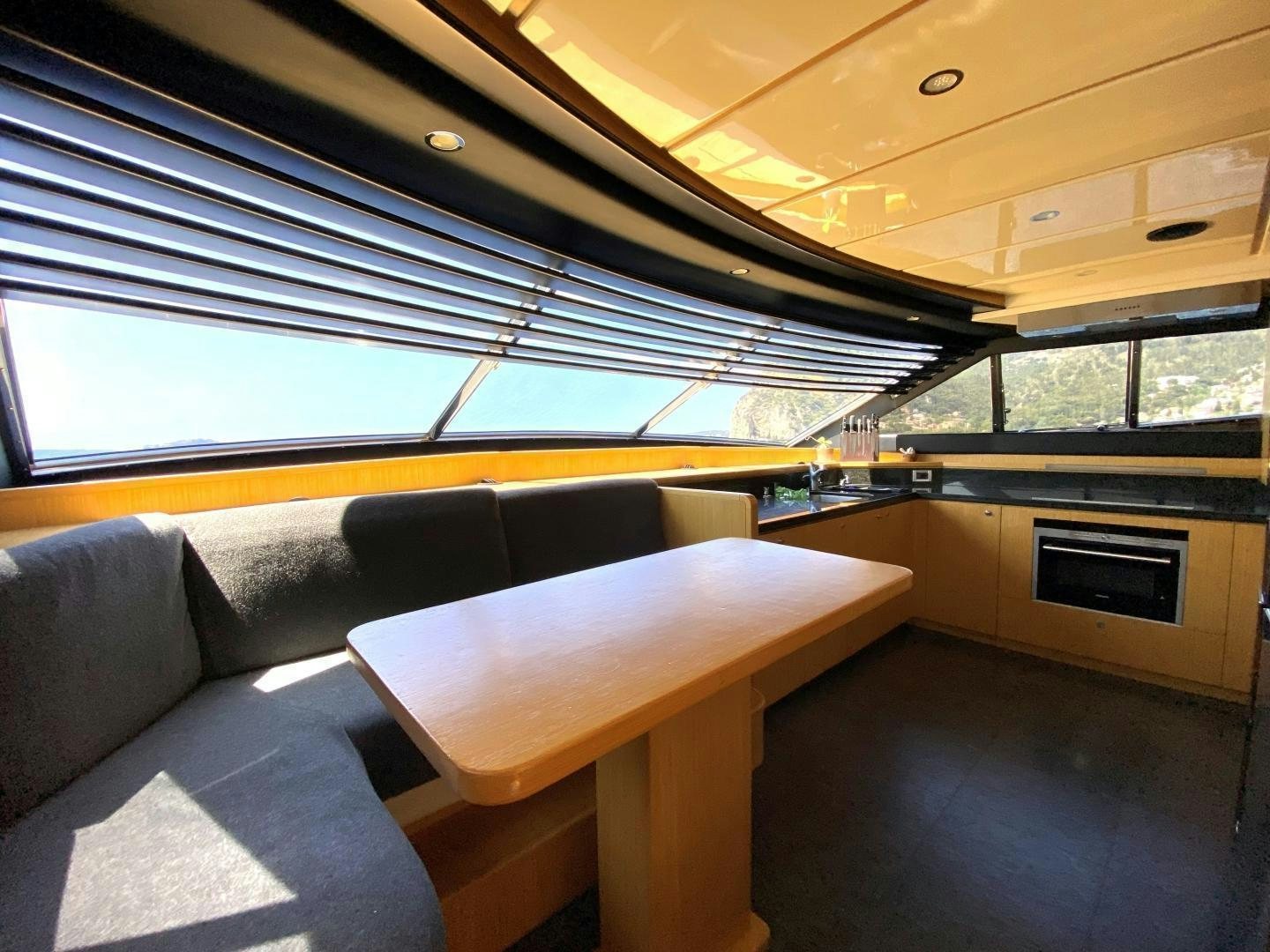 a room with a couch and a table aboard MELI Yacht for Charter