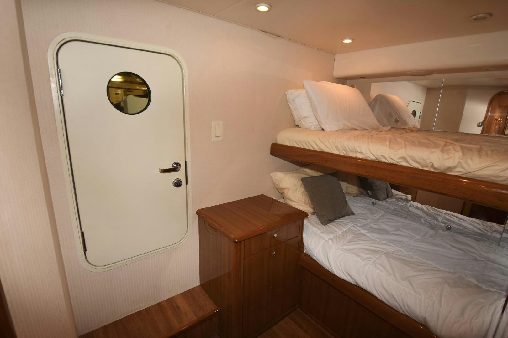 a room with a mirror and bed aboard Hoof Hearted Yacht for Sale
