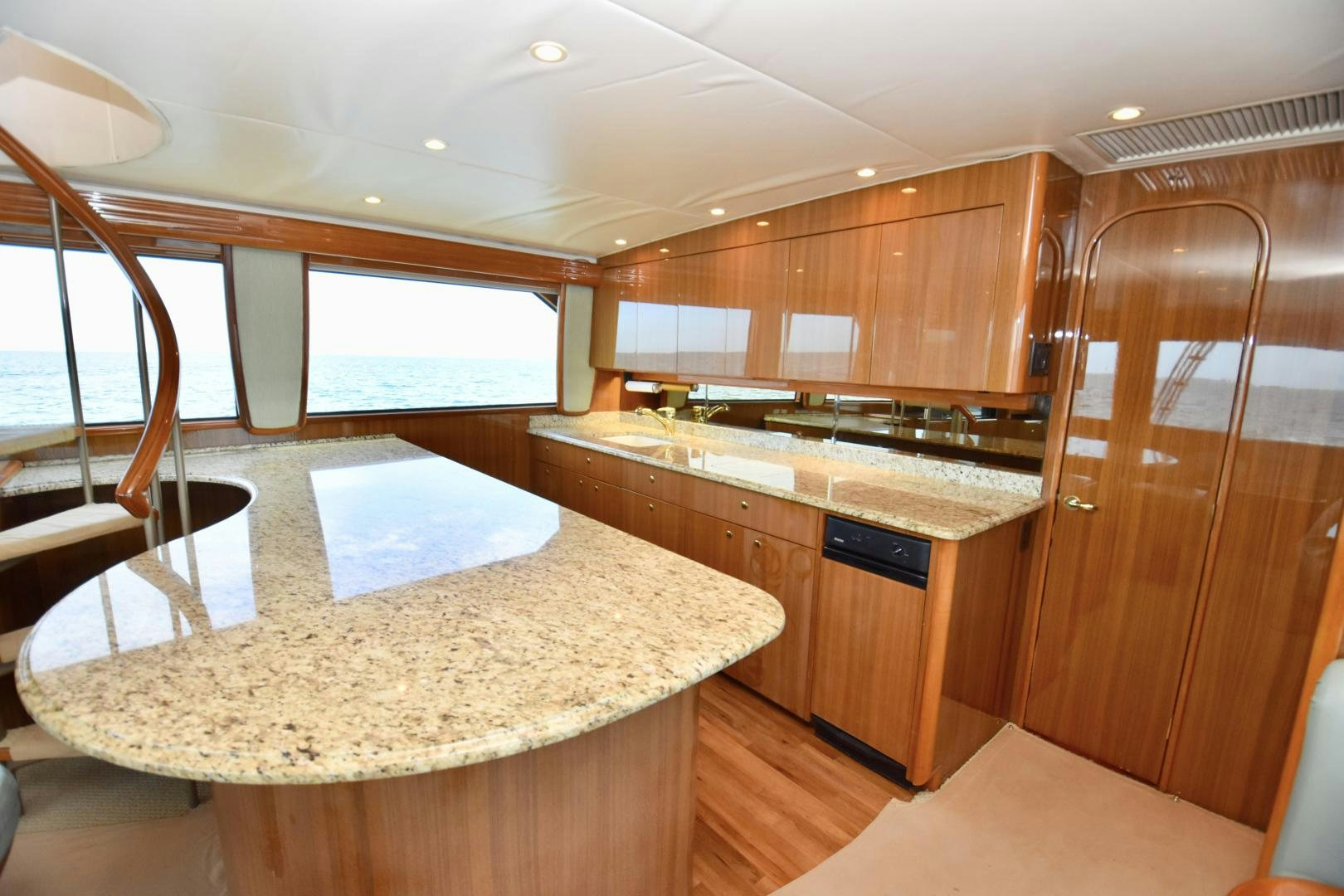 a kitchen with wooden cabinets aboard Hoof Hearted Yacht for Sale
