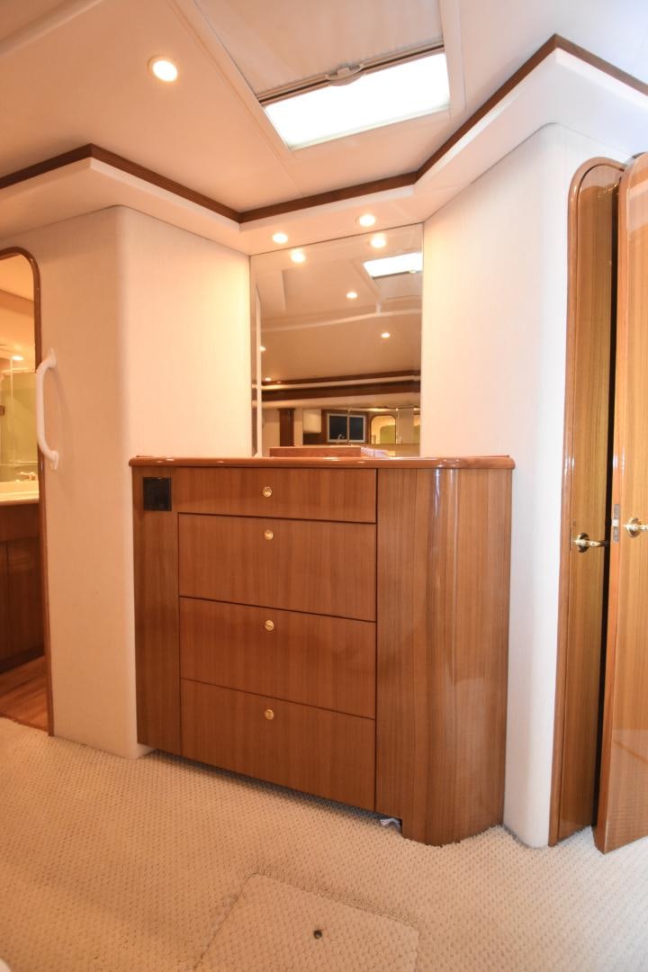 a room with a wood cabinet aboard Hoof Hearted Yacht for Sale