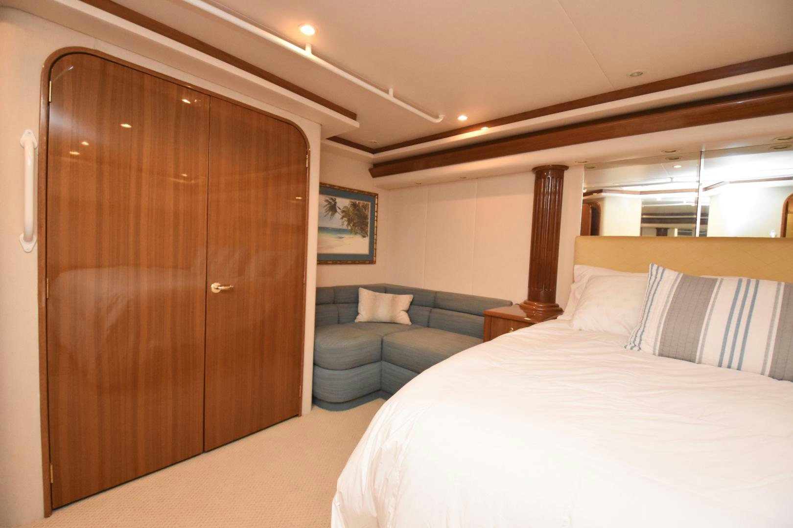 a bed and a couch in a room aboard Hoof Hearted Yacht for Sale