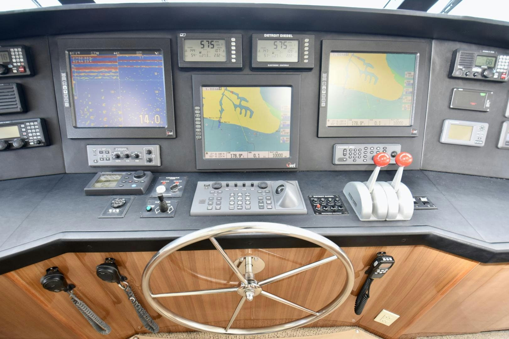 a control panel with a game console and a game controller aboard Hoof Hearted Yacht for Sale