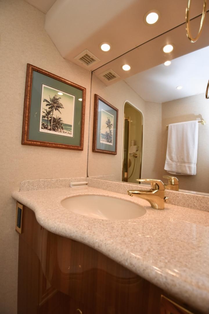 a bathroom with a sink and a mirror aboard Hoof Hearted Yacht for Sale