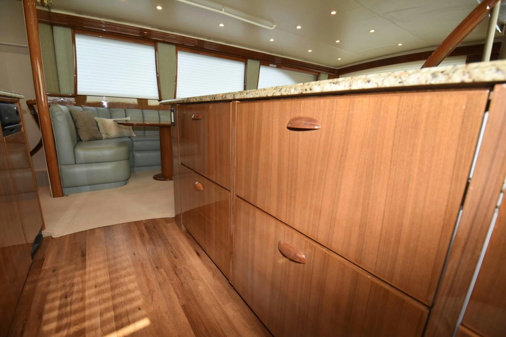 a room with a couch and a wood floor aboard Hoof Hearted Yacht for Sale