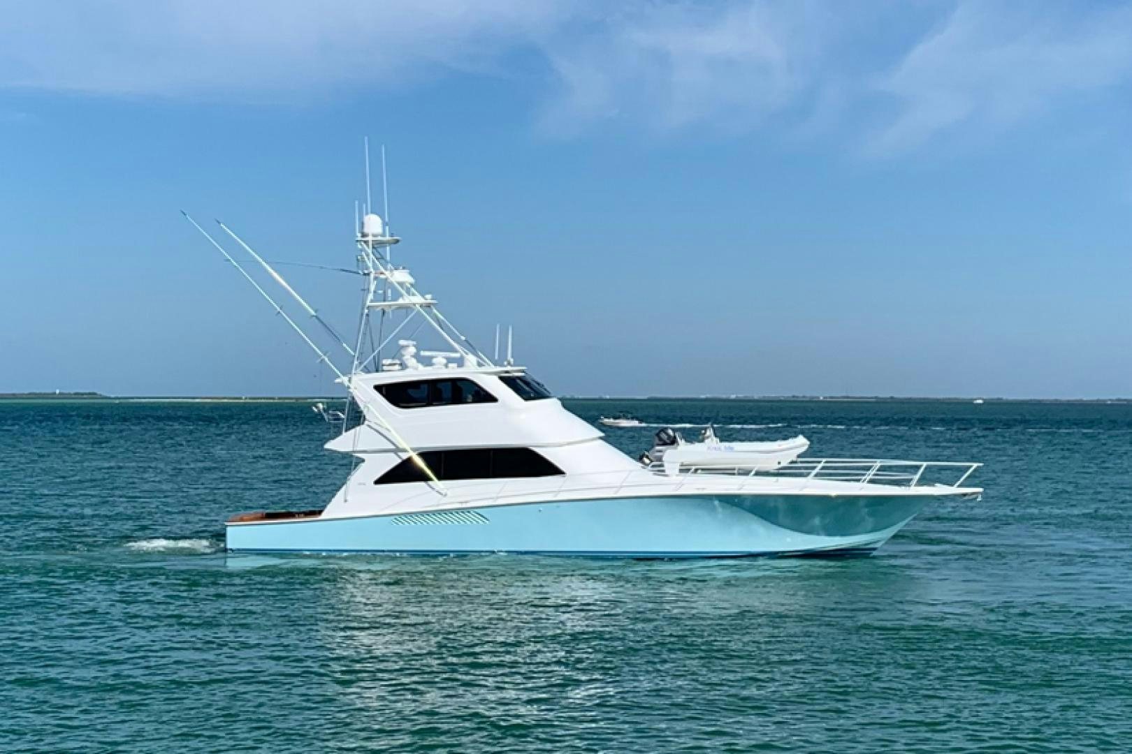 a white boat in the water aboard Hoof Hearted Yacht for Sale
