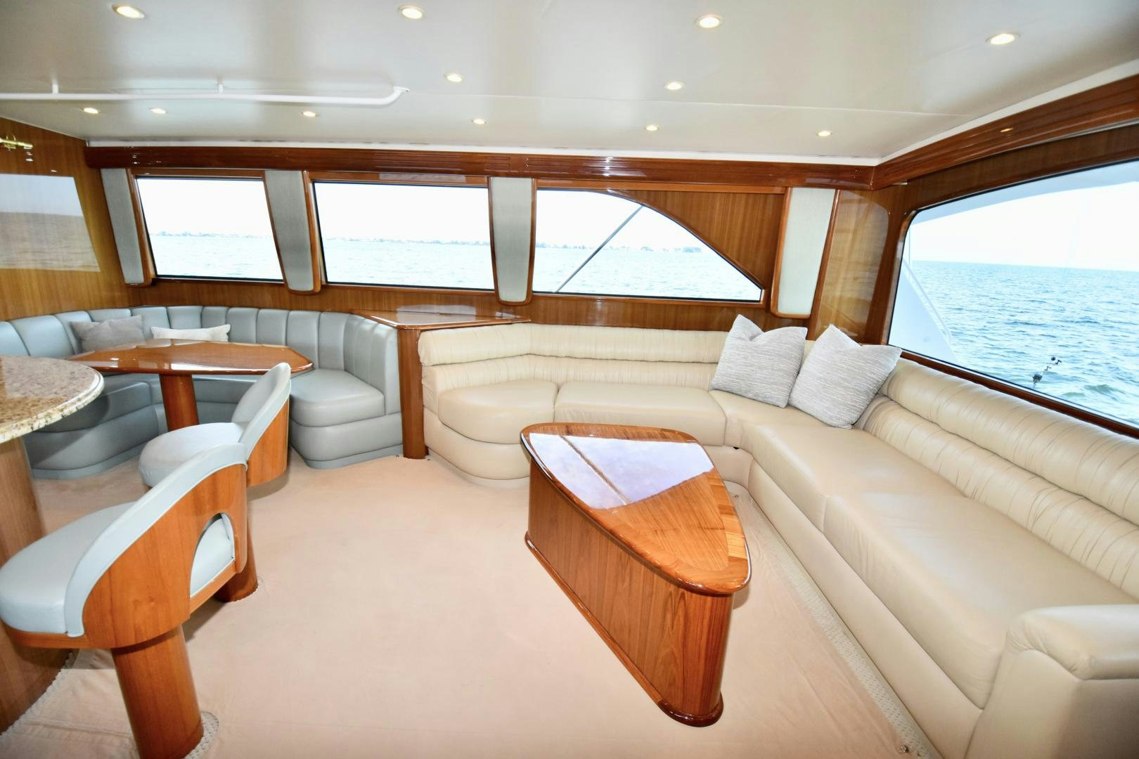 a large living room with a large window aboard Hoof Hearted Yacht for Sale