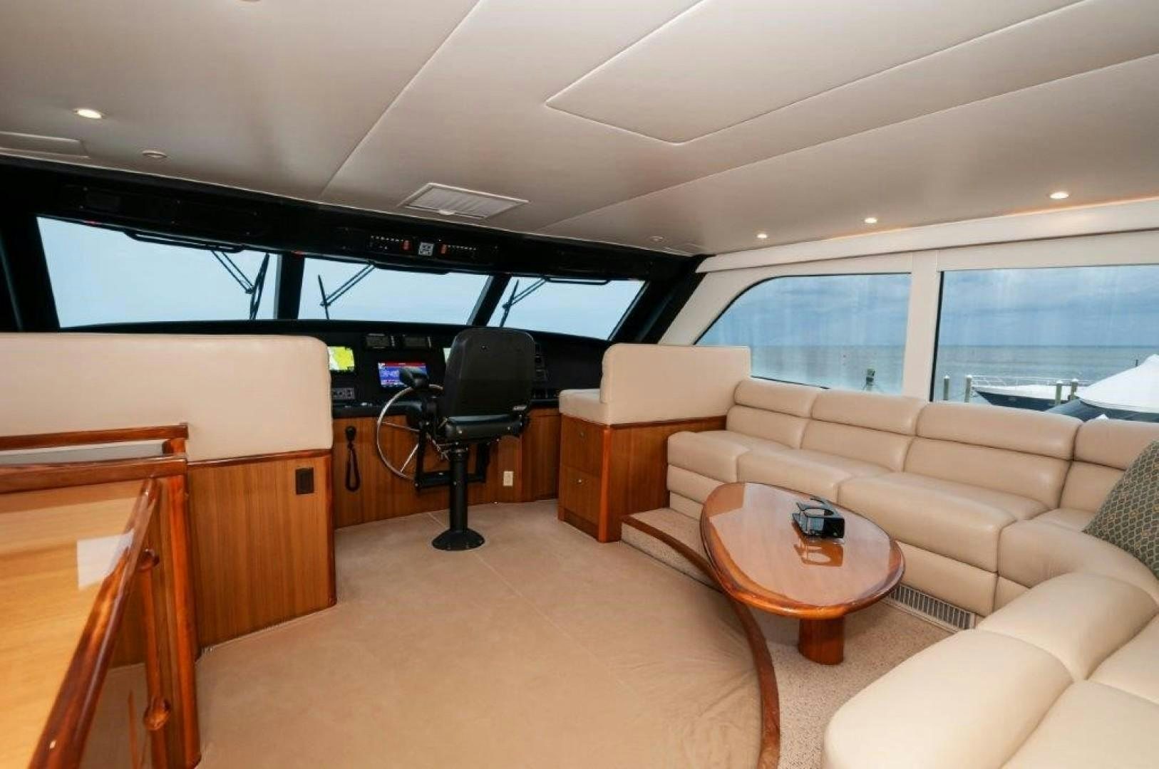 a living room with a couch and a table aboard Hoof Hearted Yacht for Sale