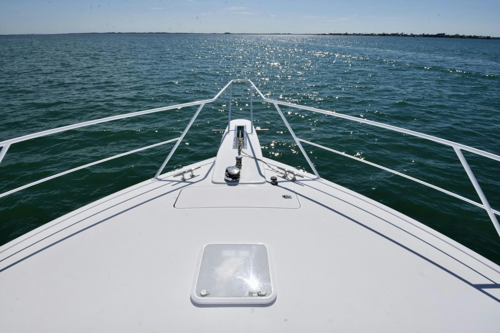 a white boat in the water aboard Hoof Hearted Yacht for Sale