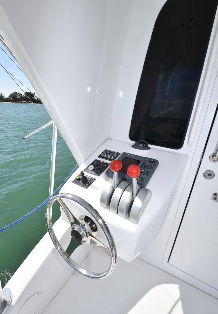 a boat with a steering wheel aboard Hoof Hearted Yacht for Sale