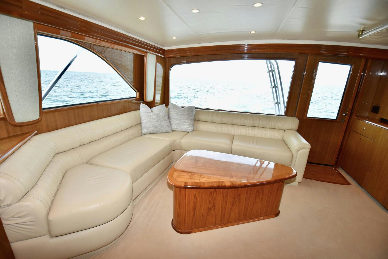 a living room with a couch and a table aboard Hoof Hearted Yacht for Sale