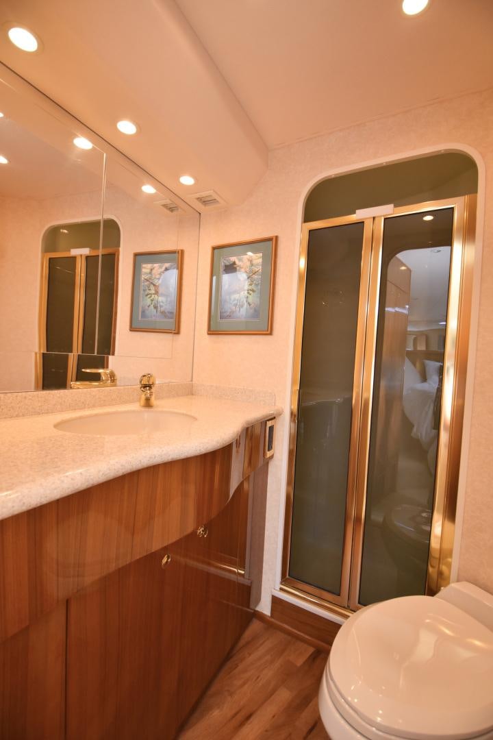 a bathroom with a sink and a toilet aboard Hoof Hearted Yacht for Sale