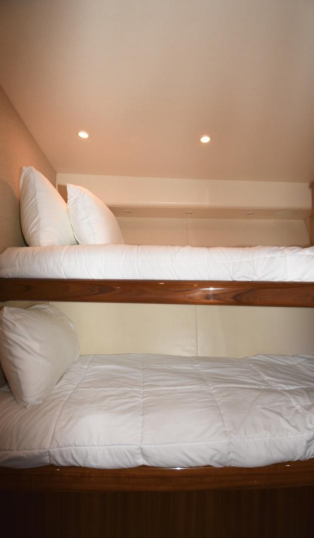 a bed with white sheets aboard Hoof Hearted Yacht for Sale