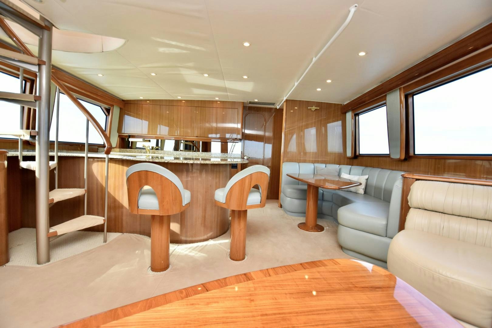 a room with a couch and a table and a chair aboard Hoof Hearted Yacht for Sale