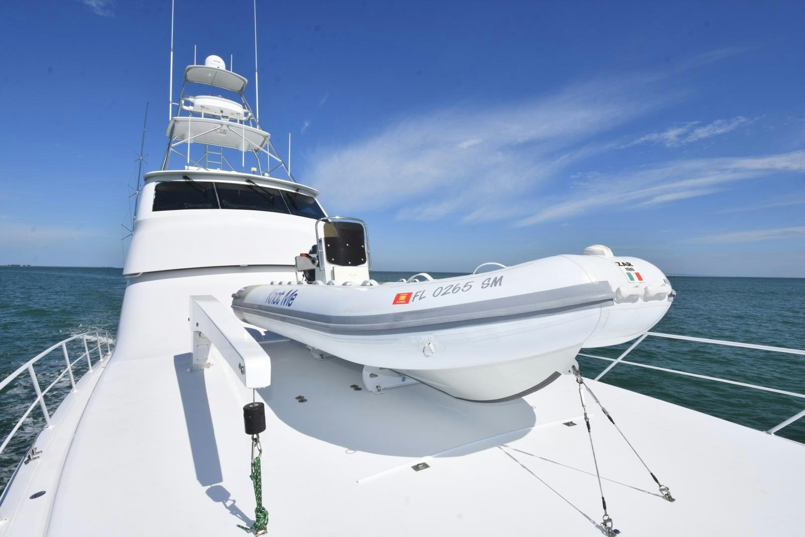 a white boat on the water aboard Hoof Hearted Yacht for Sale